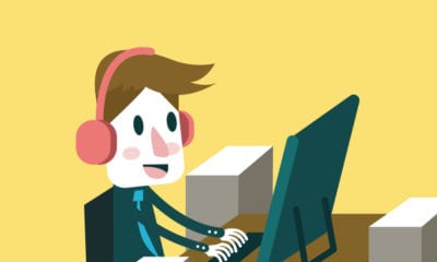 illustration of a man working at a desktop computer and listening to music with headphones on